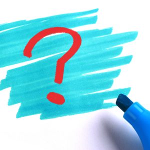 Question mark with blue marker on white background.