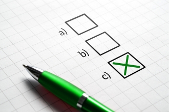 green pen on graph paper with a, b, c check boxes an x in c